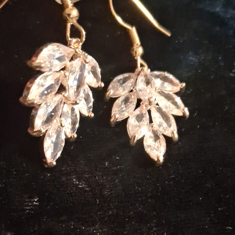 Gold and Genuine Crystal Leaf Drop Earrings Set In Gold Wash.
